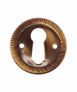 ANTIQUE STAMPED BRASS KEYHOLE COVER